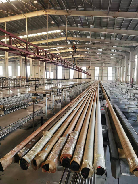 Hydraulic hose factory floor with automated hose production equipment